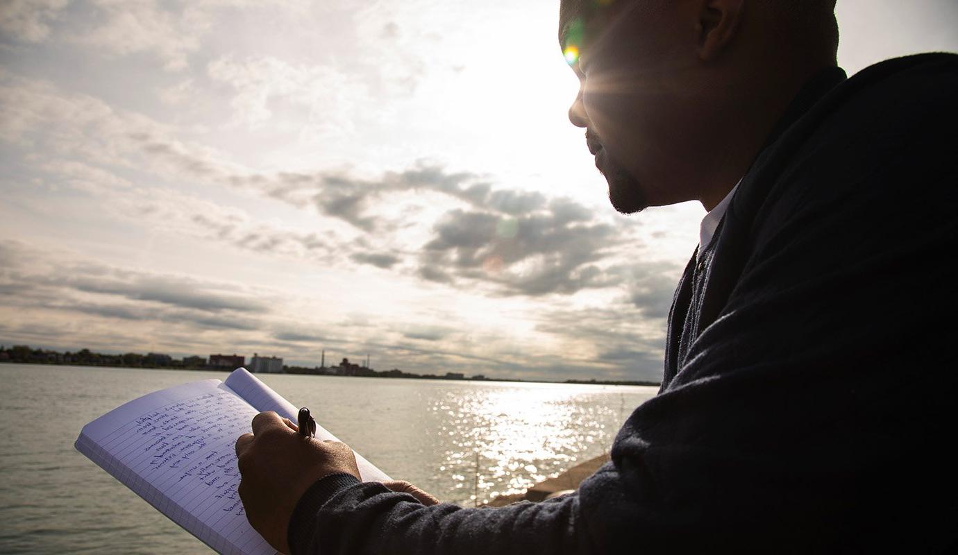 Man writing in journal